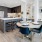 a kitchen with a dining table and chairs