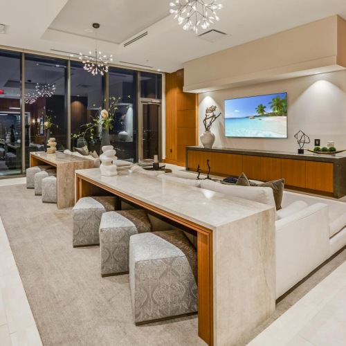 a large club room with a large table and chairs