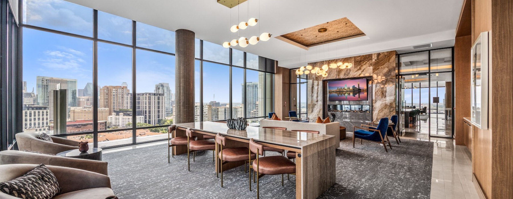 a media lounge with many windows