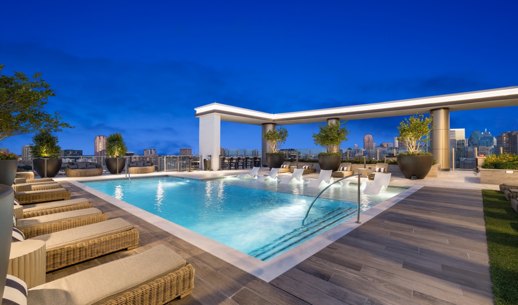 Resort-style swimming pool with lounge seating