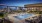 Rendering of pool deck with day beds, sun loungers, in water loungers, and view of Dallas in the background