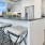 a kitchen with a bar stools