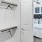 a walk-in closet with a white door